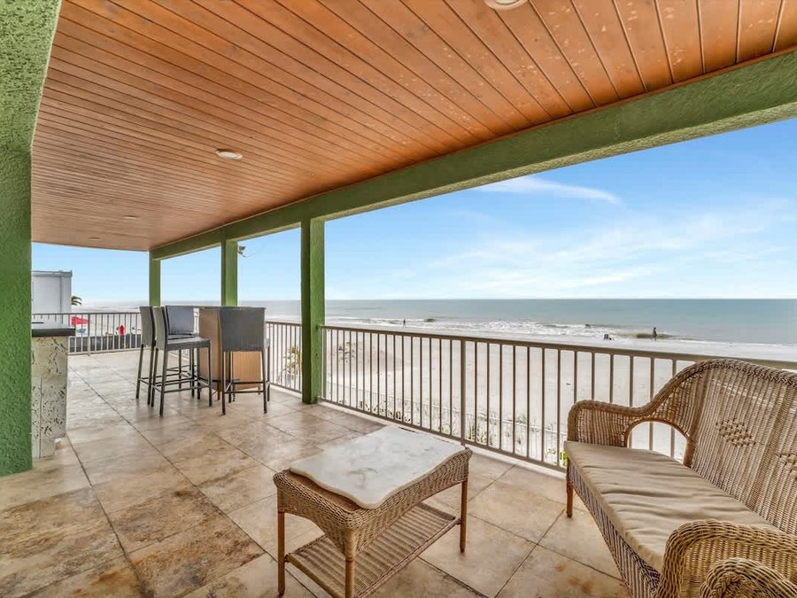 Beachfront balcony at a managed listing in Indian Rocks Beach, Florida